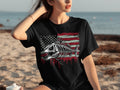 Black t-shirt with a distressed American flag and a fish skeleton graphic.