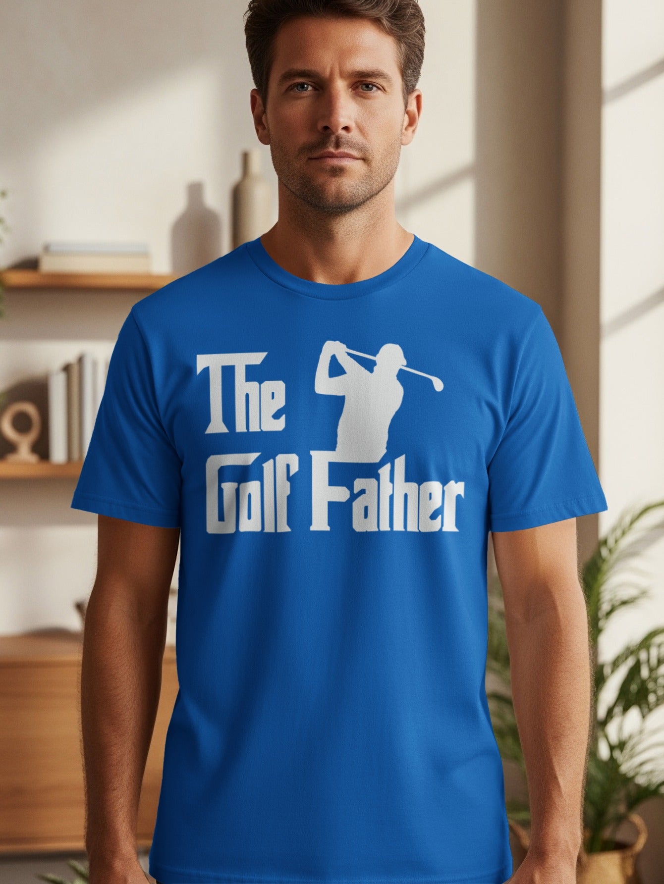 Blue t-shirt with white text and a golfer silhouette: "The Golf Father"