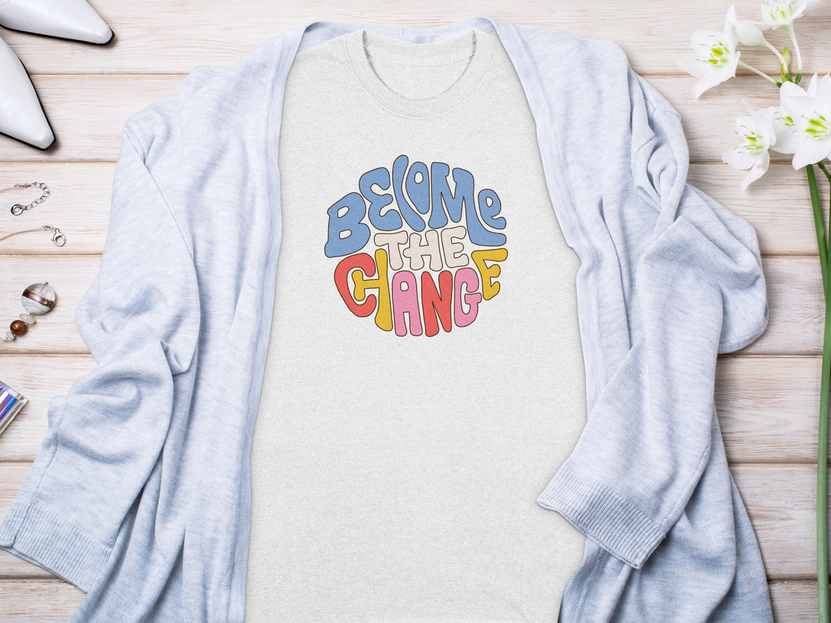 Light gray t-shirt with "Become the Change" text in colorful retro font.