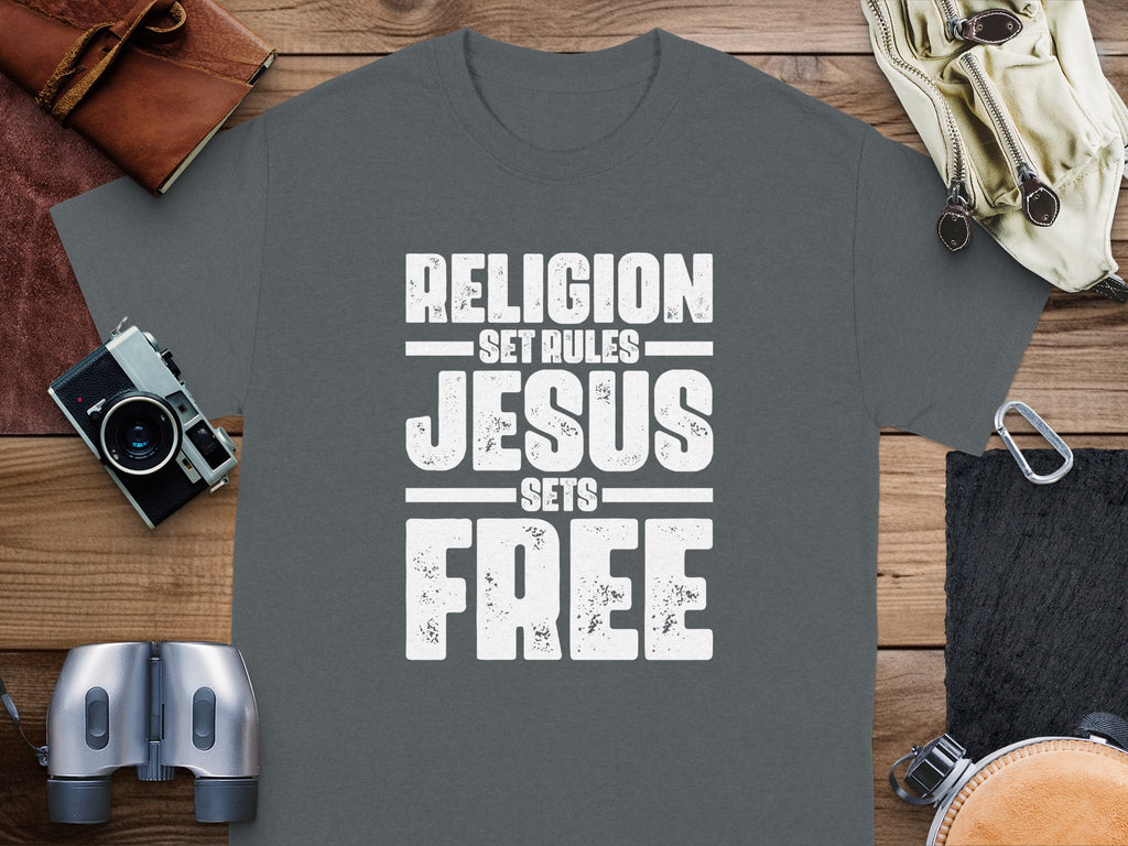 Grey t-shirt with "RELIGION SET RULES JESUS SETS FREE" text in white.
