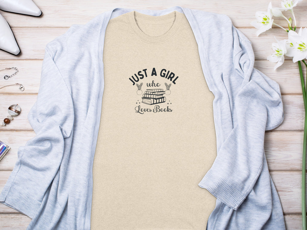 Light-colored t-shirt with "Just a girl who loves books" text graphic
