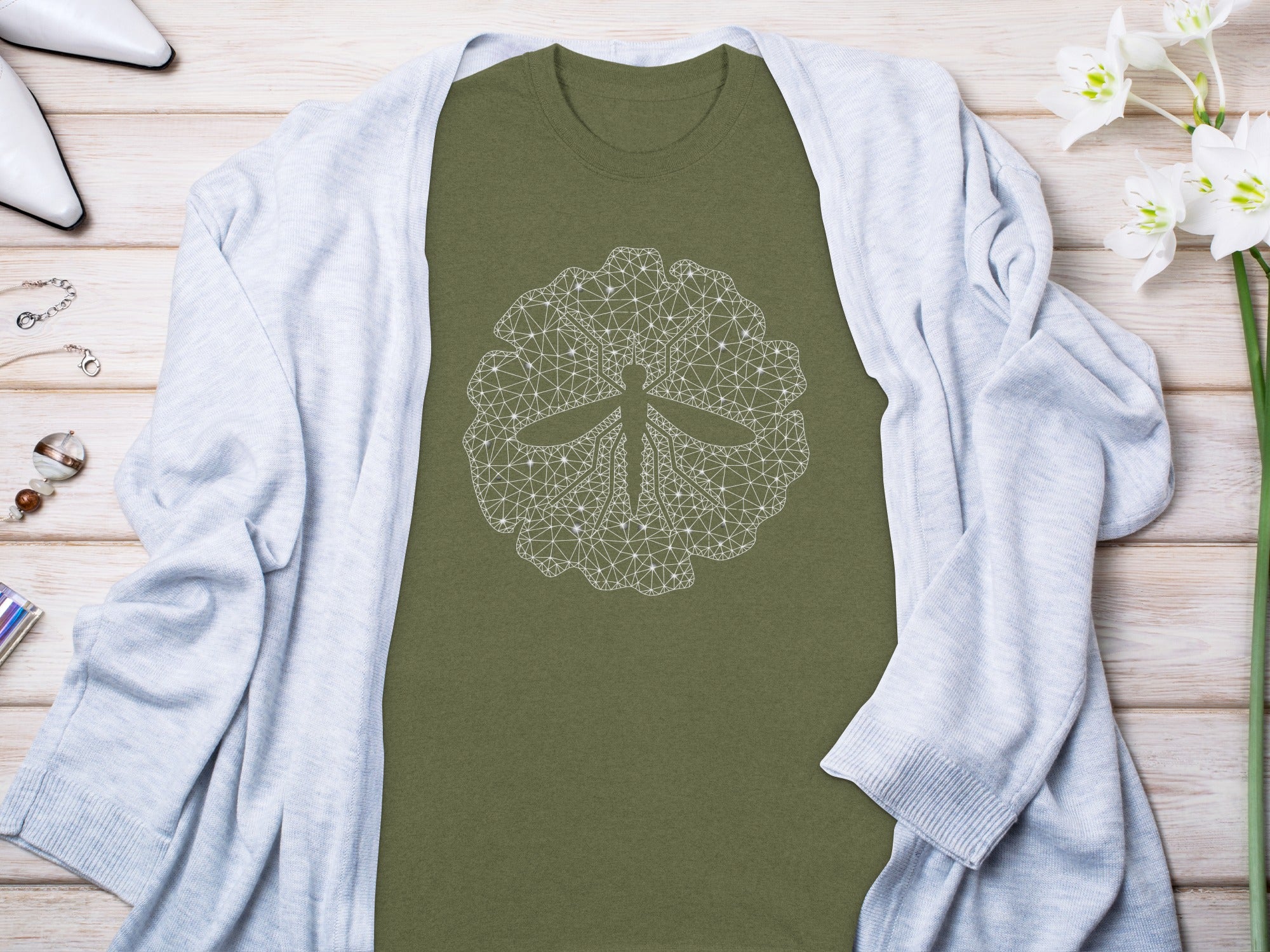 Olive green t-shirt with white geometric dragonfly mandala graphic.