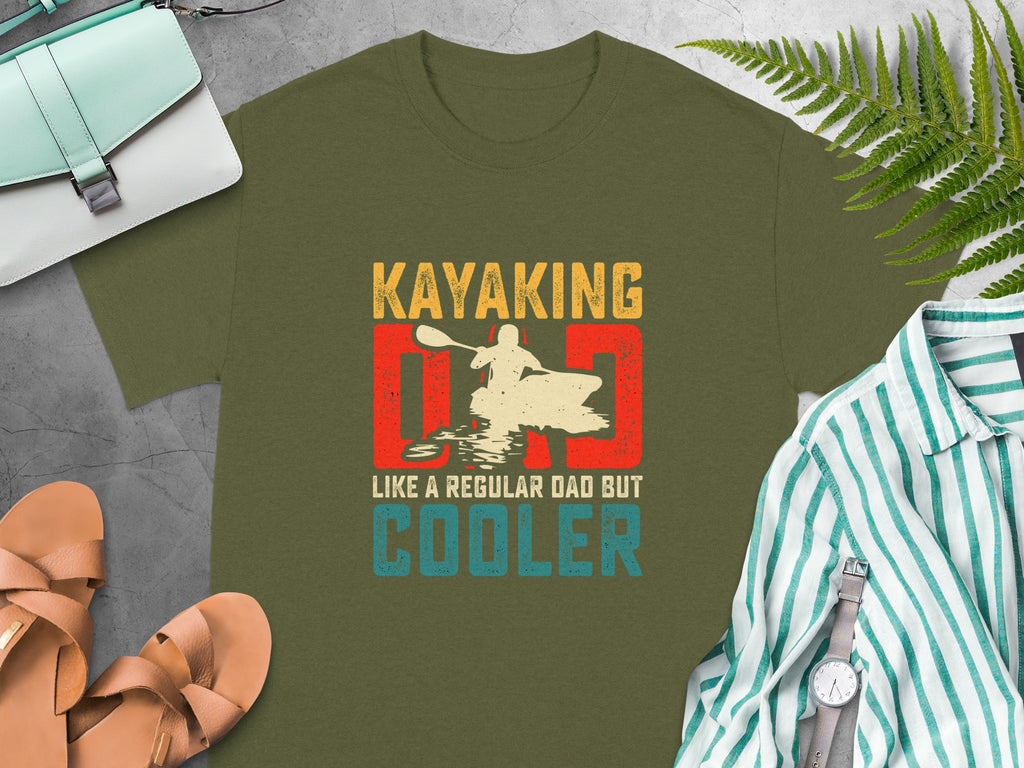 Olive green t-shirt with "Kayaking Dad Like a Regular Dad But Cooler" text and graphic.