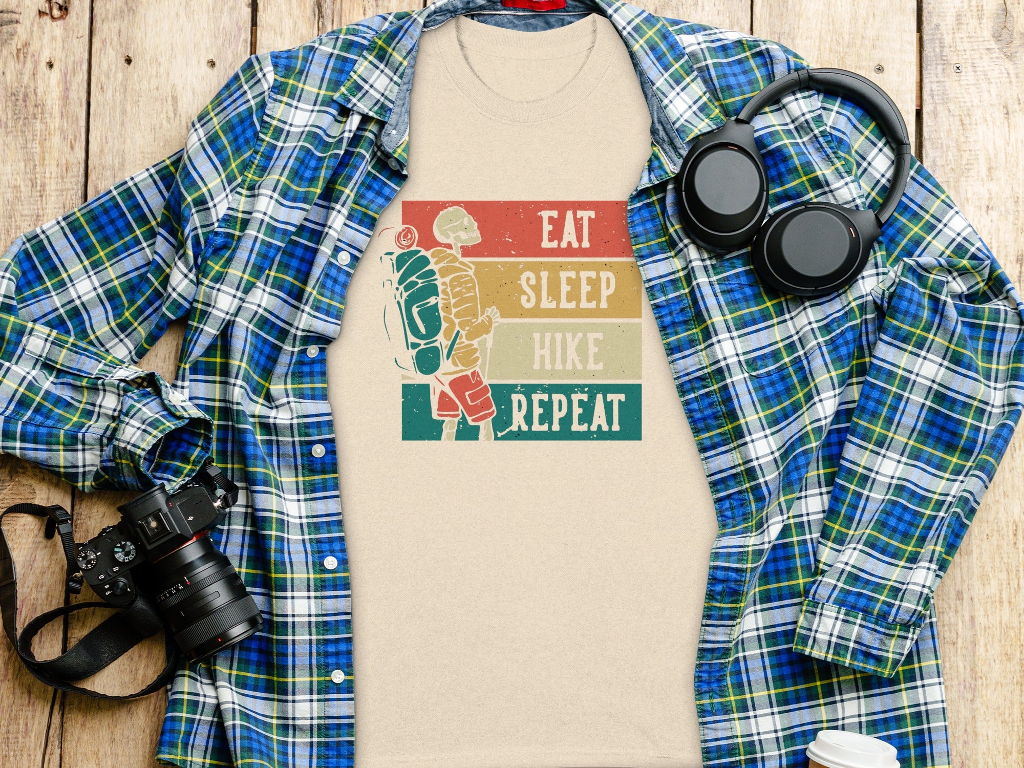 T-shirt with skeleton hiker graphic and text "Eat Sleep Hike Repeat"