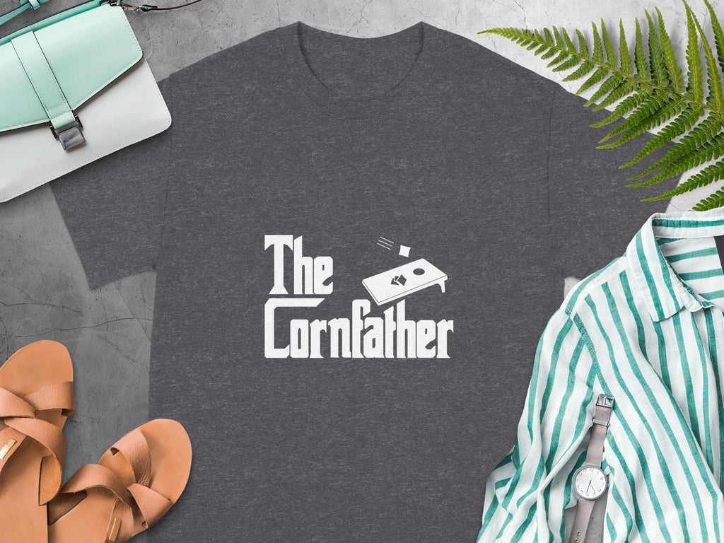 Dark grey t-shirt with "The Cornfather" text and cornhole board graphic.