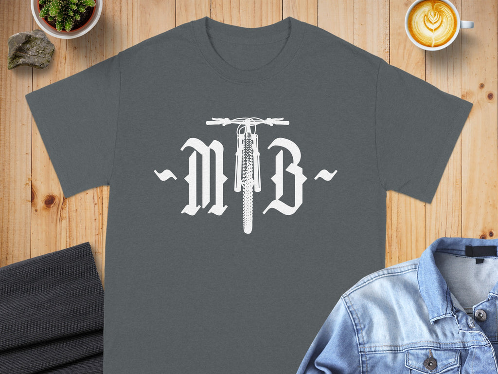 Dark grey t-shirt with white "MB" logo featuring a bicycle front wheel.