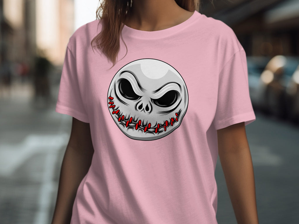 Pink t-shirt with a stitched facial graphic of a skull wearing a crown.