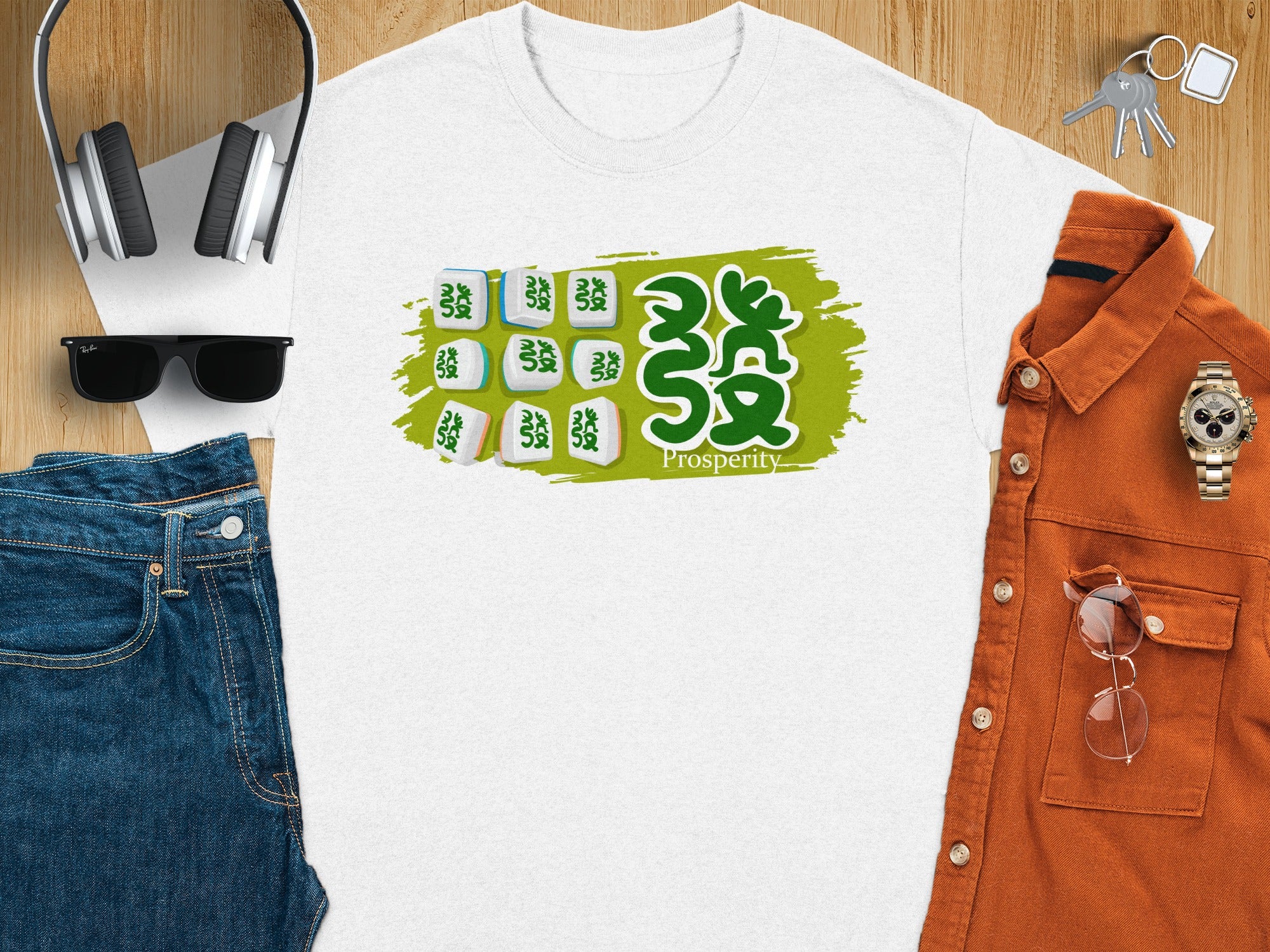 White t-shirt with green mahjong tiles graphic and "Prosperity" text