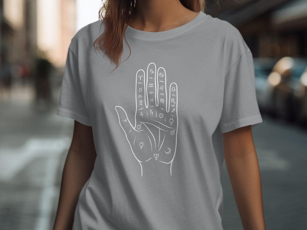 Grey t-shirt with white palmistry hand and astrological symbols design.