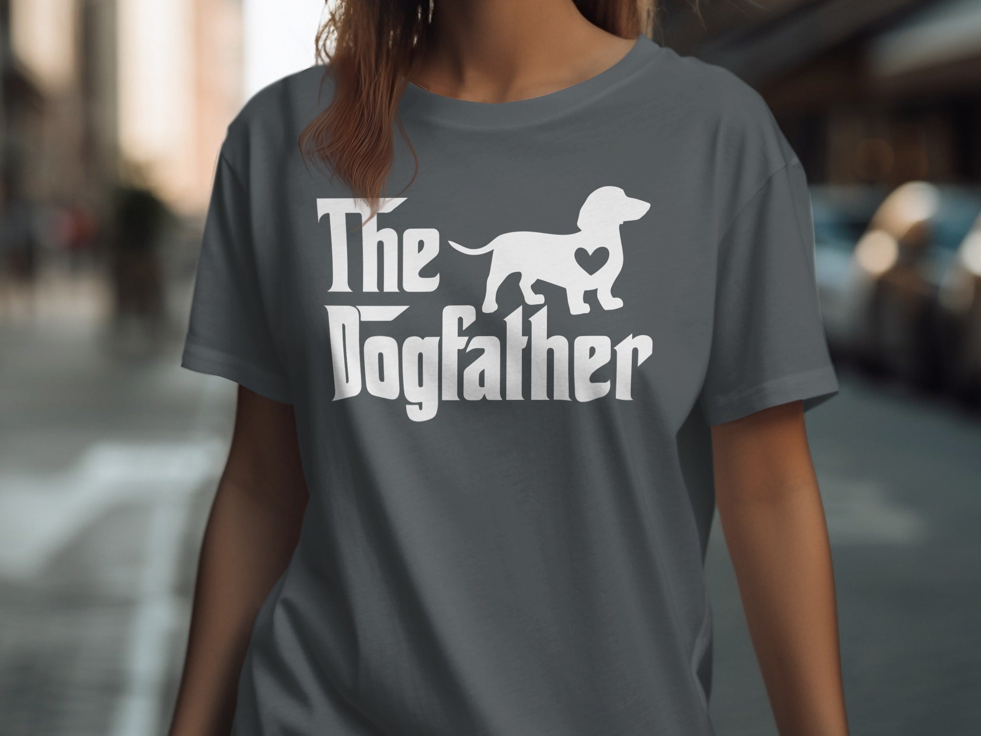 Grey t-shirt with white text and a silhouette of a dog with a heart.