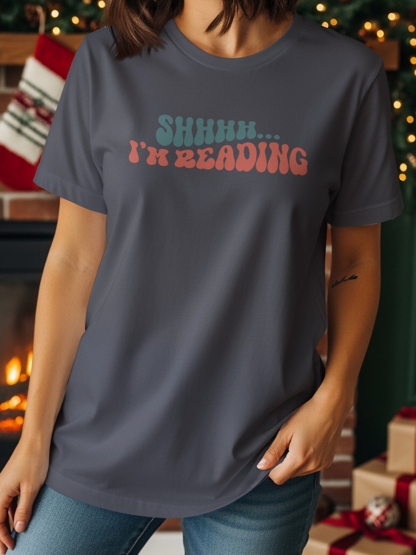 Dark grey t-shirt with "SHHHH... I'M READING" text in retro font.