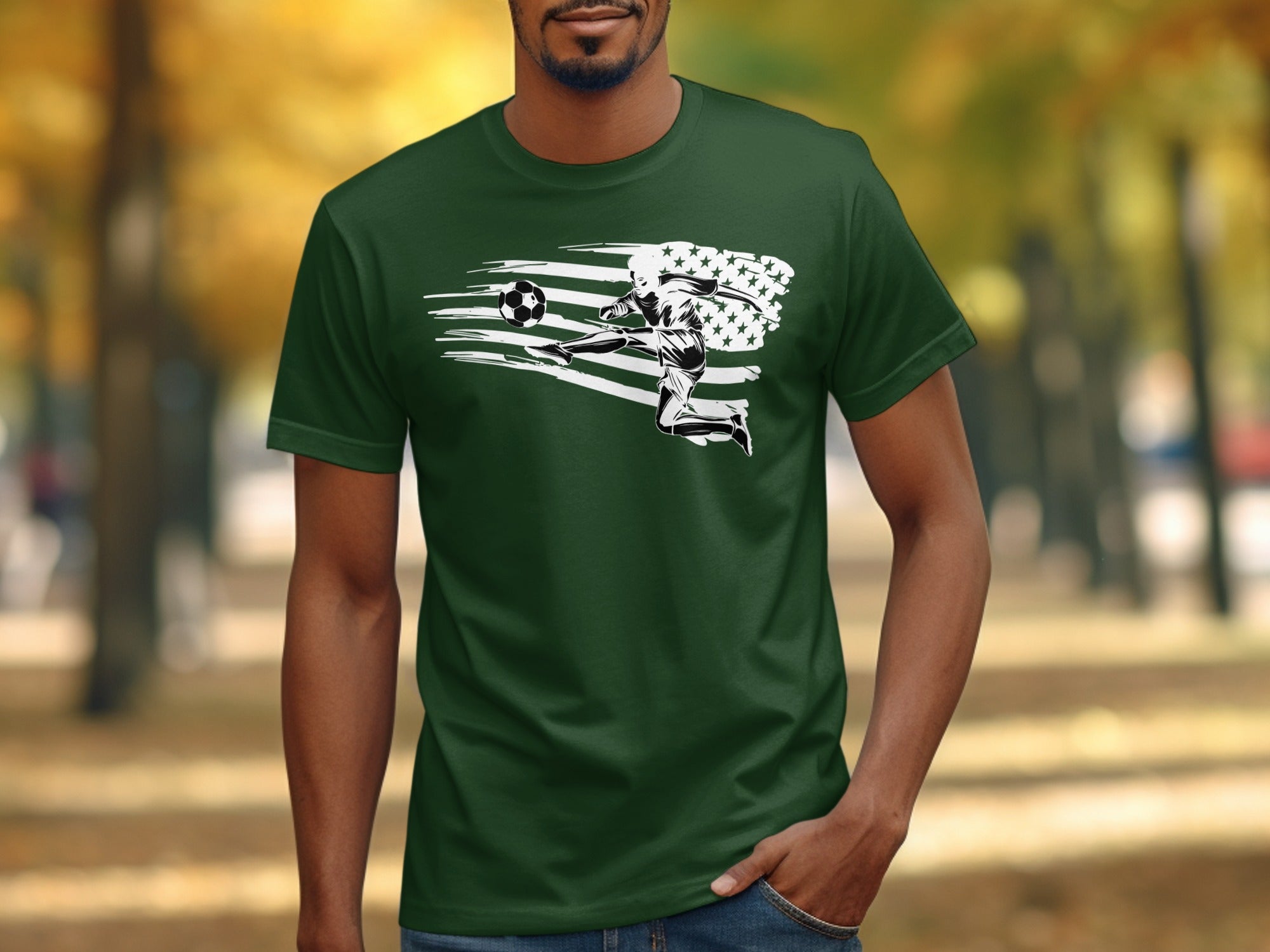 Green t-shirt with graphic of soccer player kicking ball with stars and stripes flag behind.