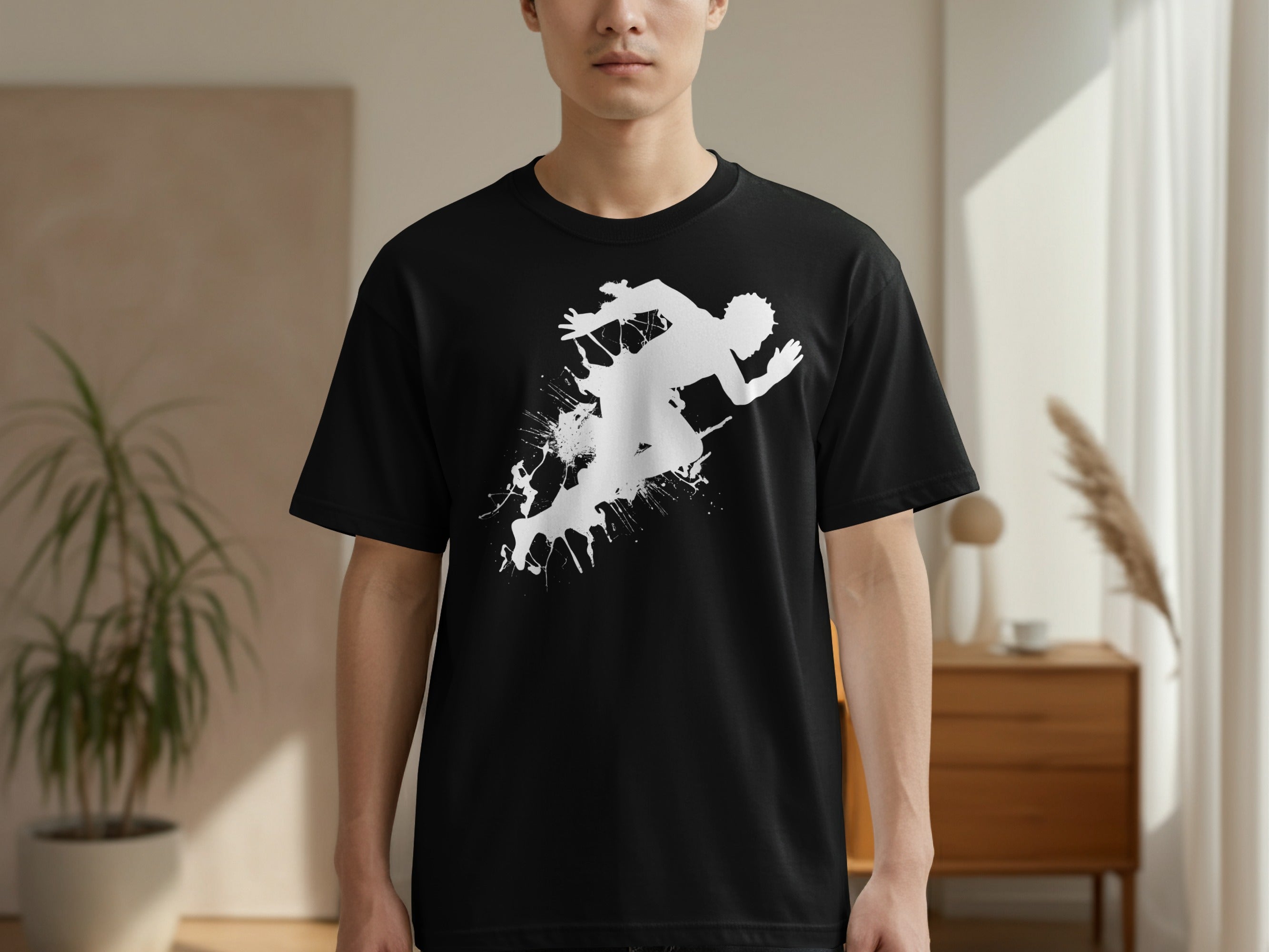 Black t-shirt with a white splatter graphic of a runner in motion.