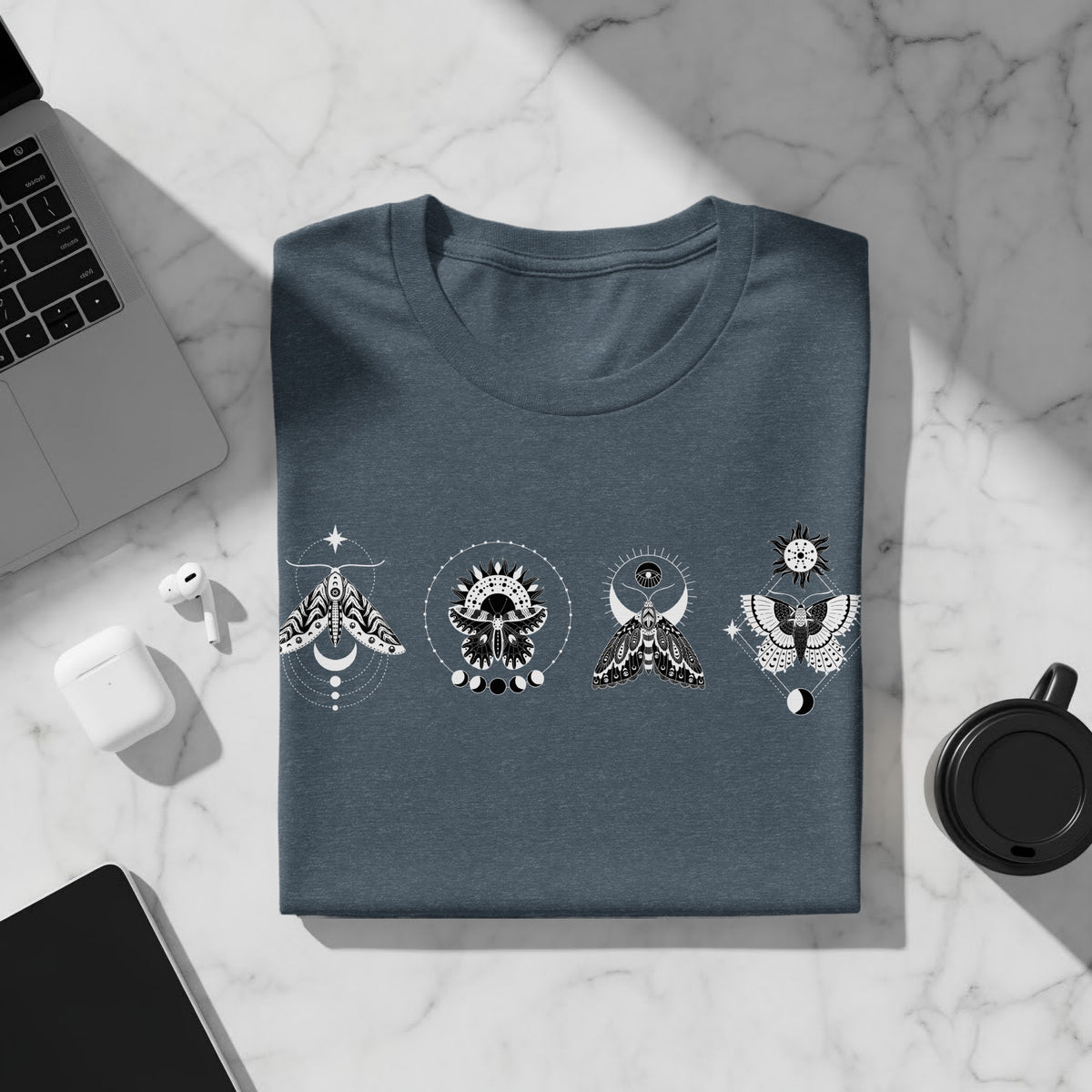 Dark blue t-shirt with a white celestial moth design on the front.