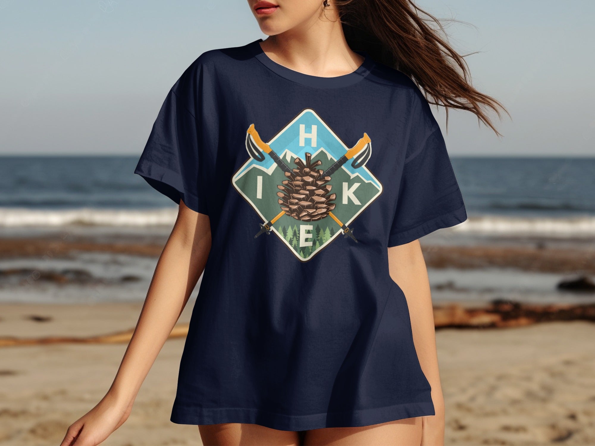 Navy t-shirt with a diamond logo featuring a pinecone, hiking poles, and the word HIK.