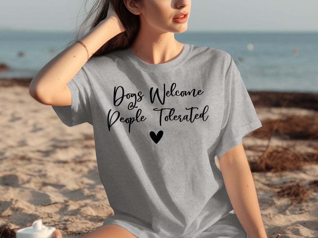 Gray t-shirt with "Dogs Welcome People Tolerated" and a heart.
