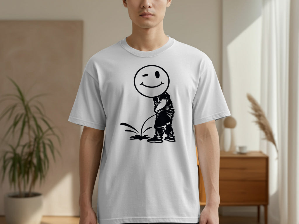 White t-shirt with a black graphic of a smiling, winking smiley face over a peeing figure.
