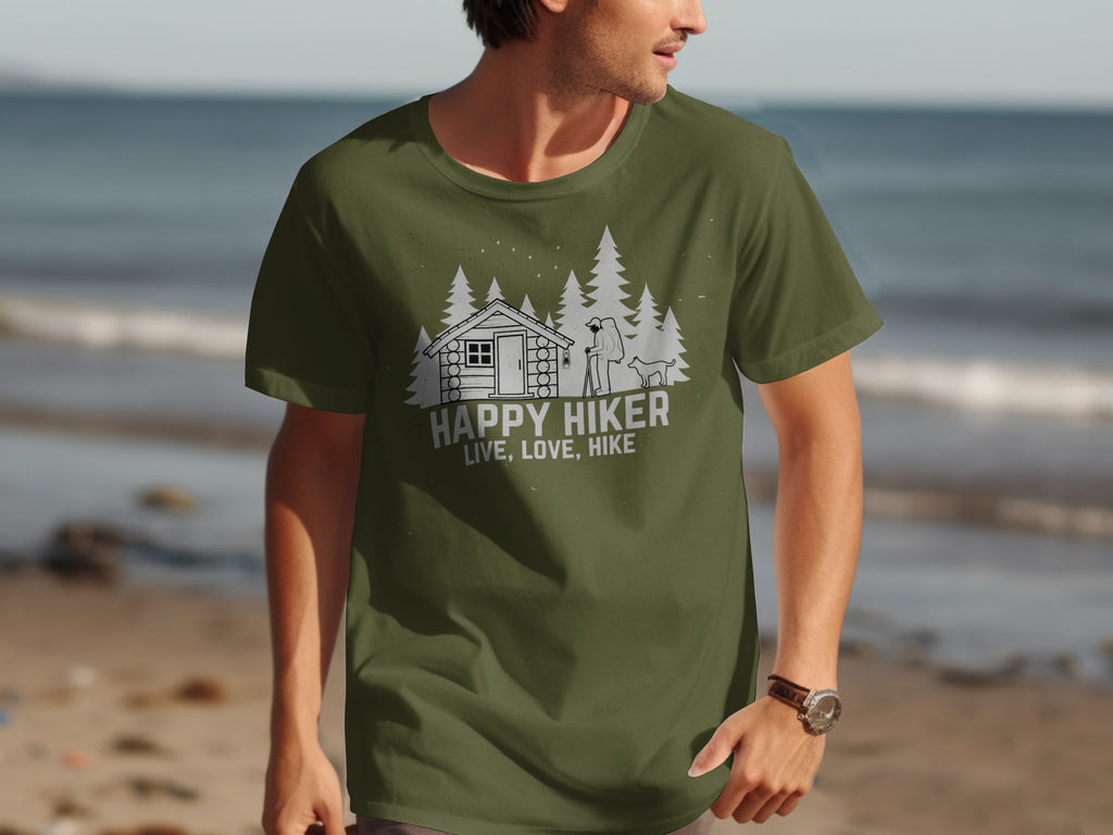 Green t-shirt with white graphic: cabin, trees, hiker, dog, text "HAPPY HIKER LIVE, LOVE, HIKE."
