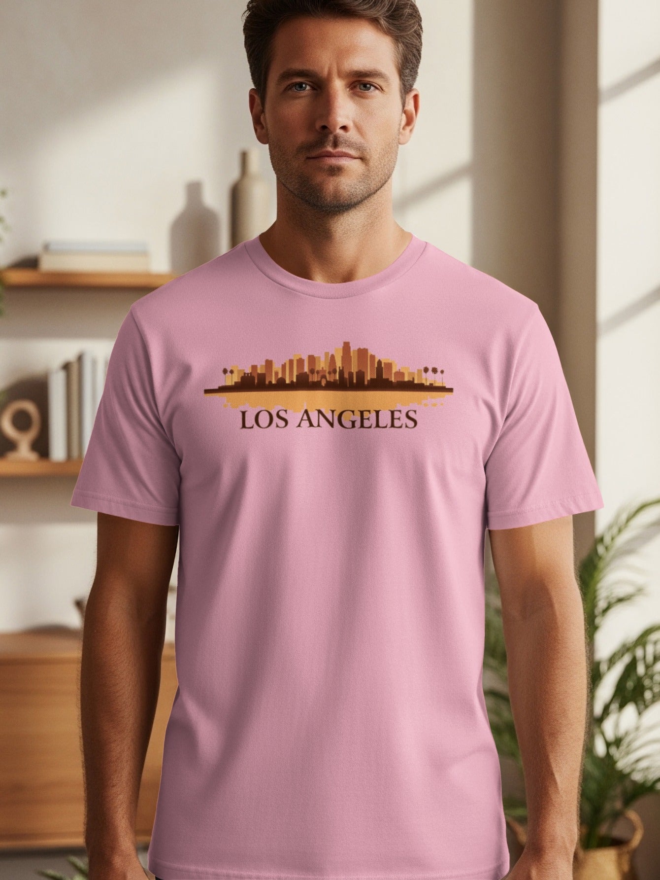 Pink t-shirt with Los Angeles skyline graphic and text.