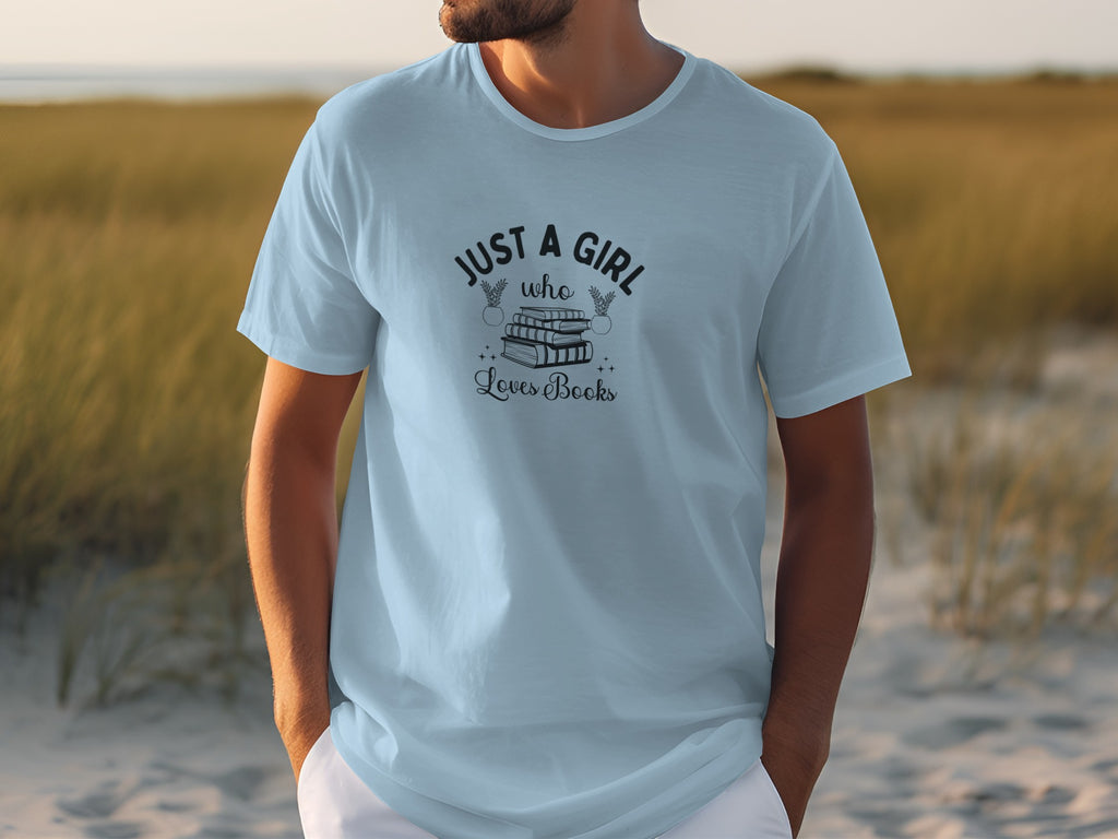 Light blue t-shirt with graphic text "JUST A GIRL who Loves Books" and stacked books.