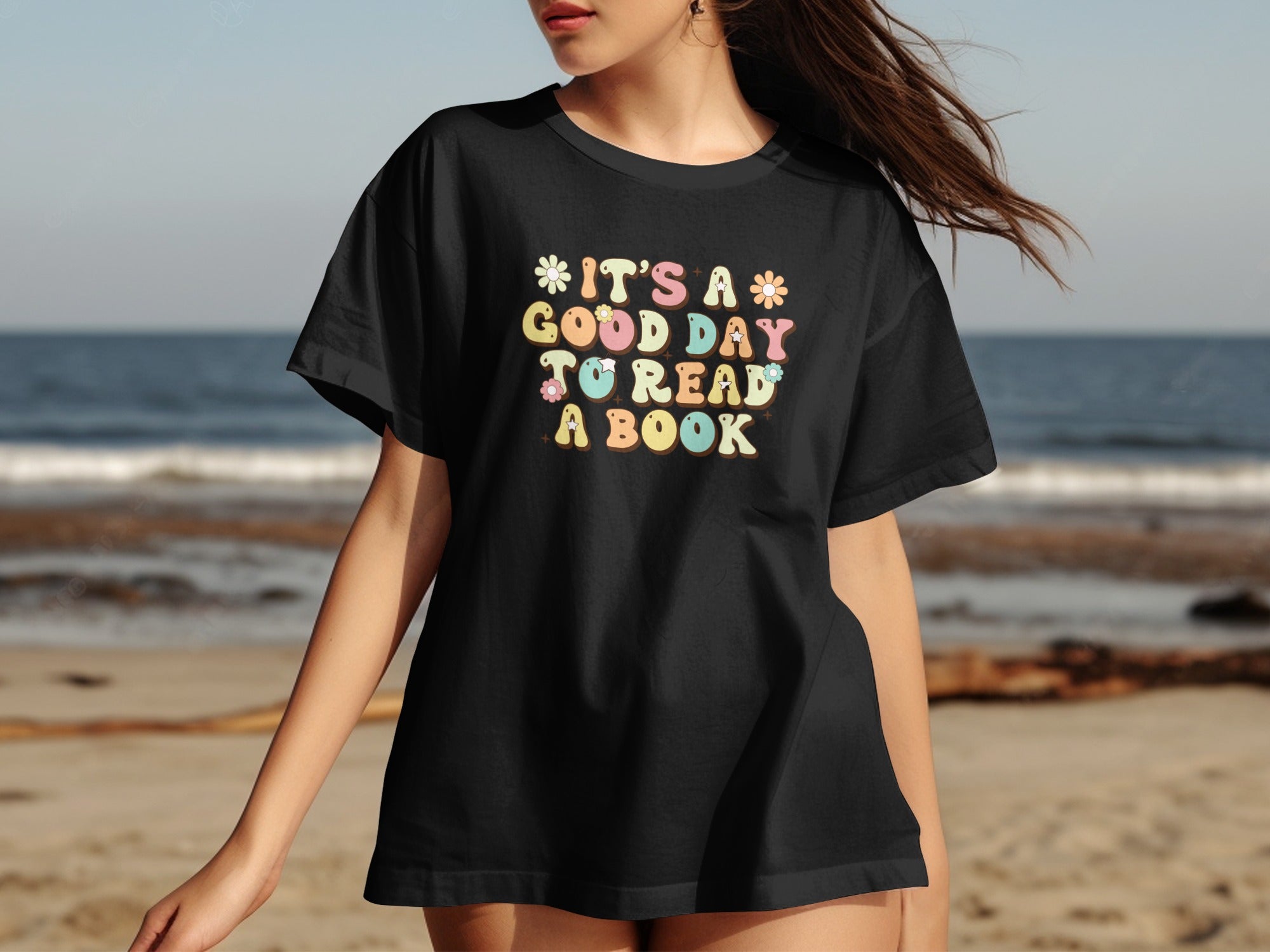 Black t-shirt with colorful text reading "It's a good day to read a book."