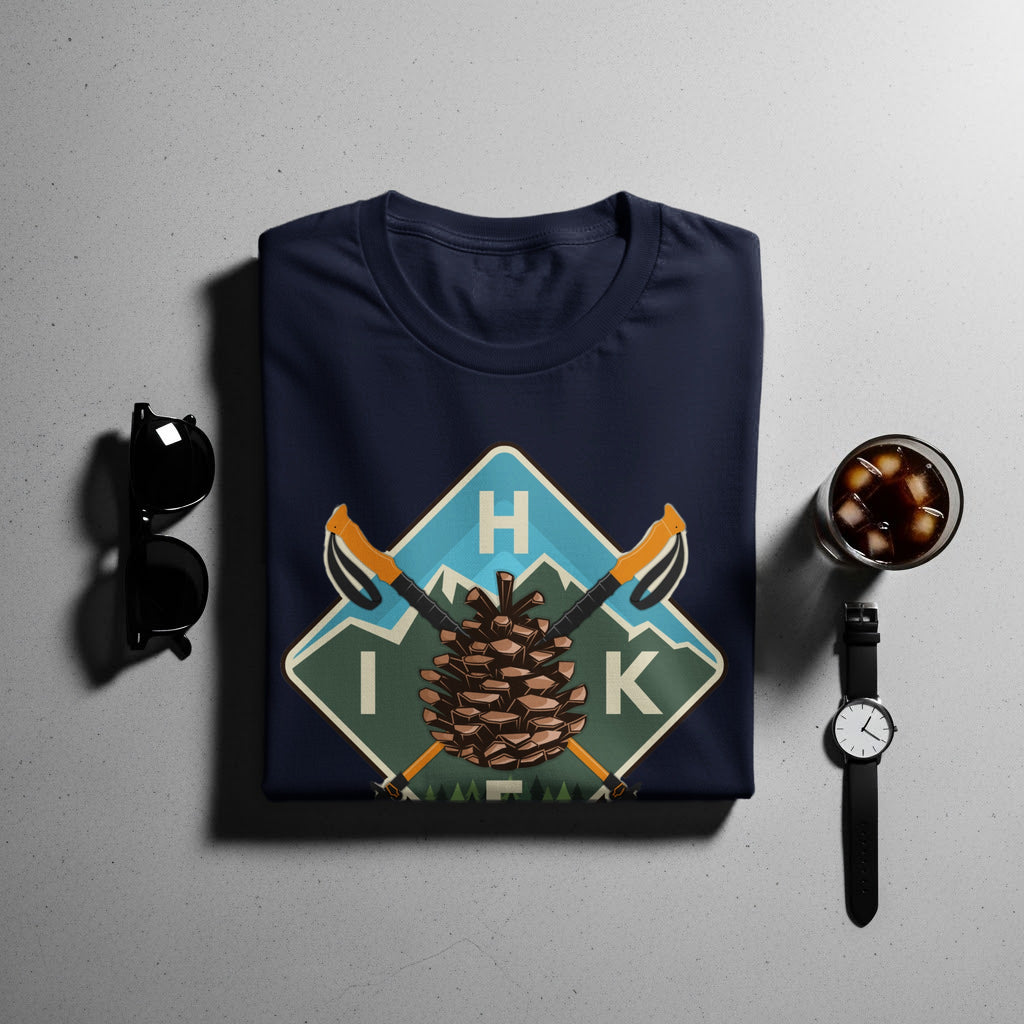Navy t-shirt with a pinecone, hiking poles, and "I H K" graphic.