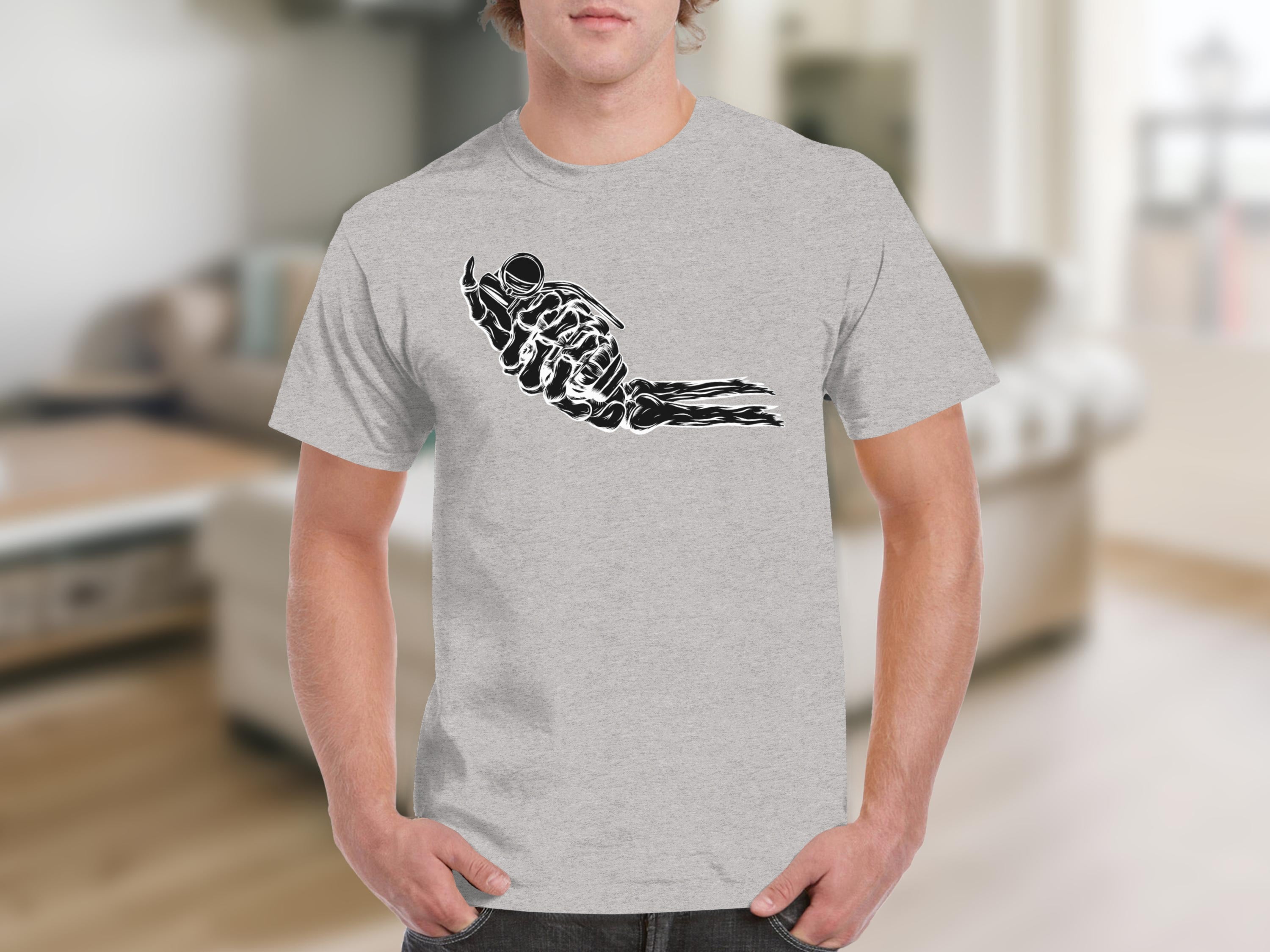 Black graphic of skeleton hand holding up bomb on grey t-shirt.