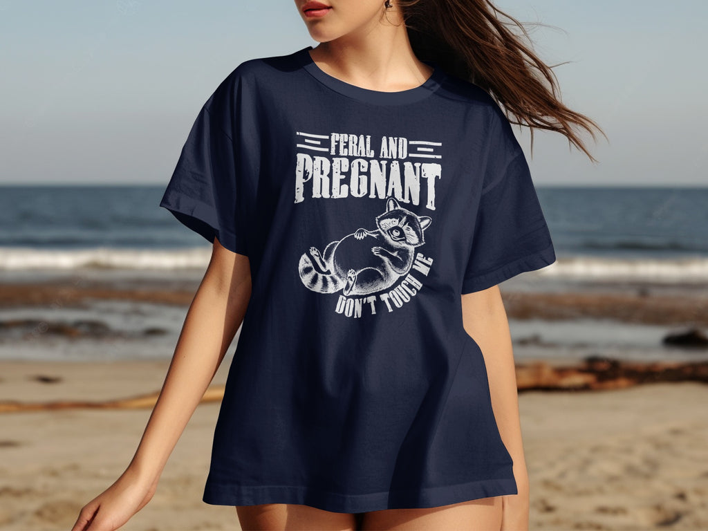 Navy t-shirt with "FERAL AND PREGNANT DON'T TOUCH ME" and a raccoon graphic.