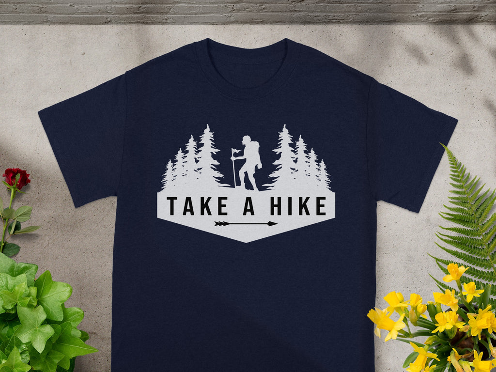 Navy t-shirt with white graphic of hiker, trees, and "Take a Hike" text.