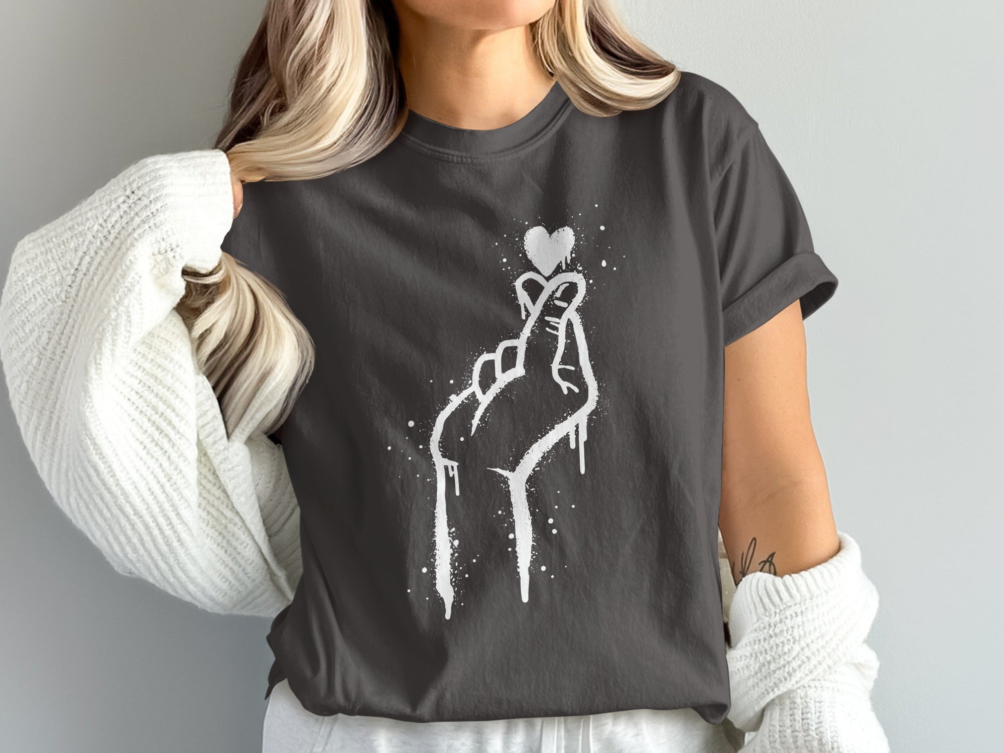 T-shirt with white dripping heart finger gesture design