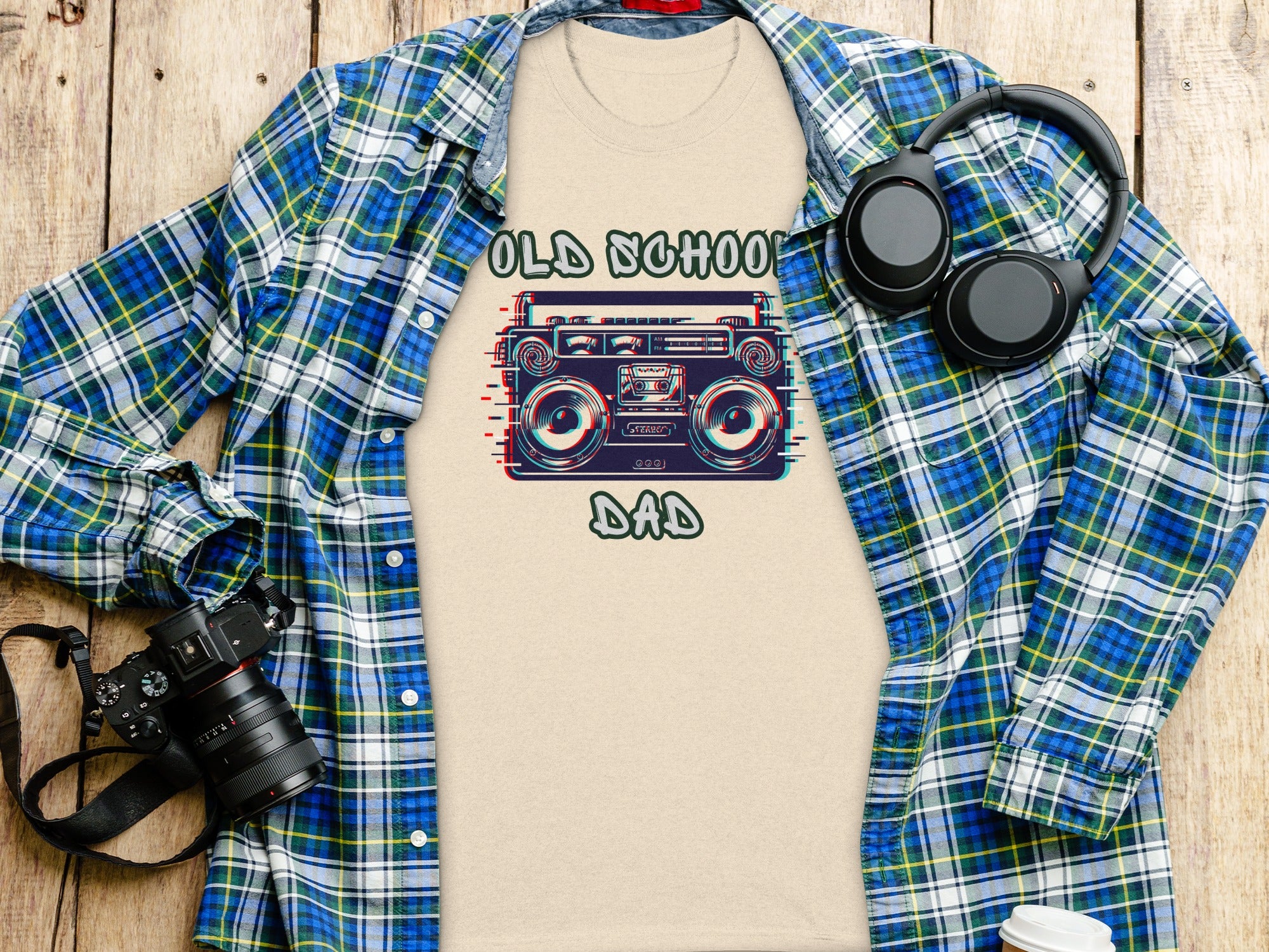 T-shirt with "Old School Dad" and boombox graphic, seen with headphones and camera.
