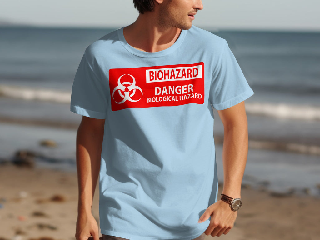 Light blue t-shirt with a red biohazard danger biological hazard warning sign graphic across the chest.