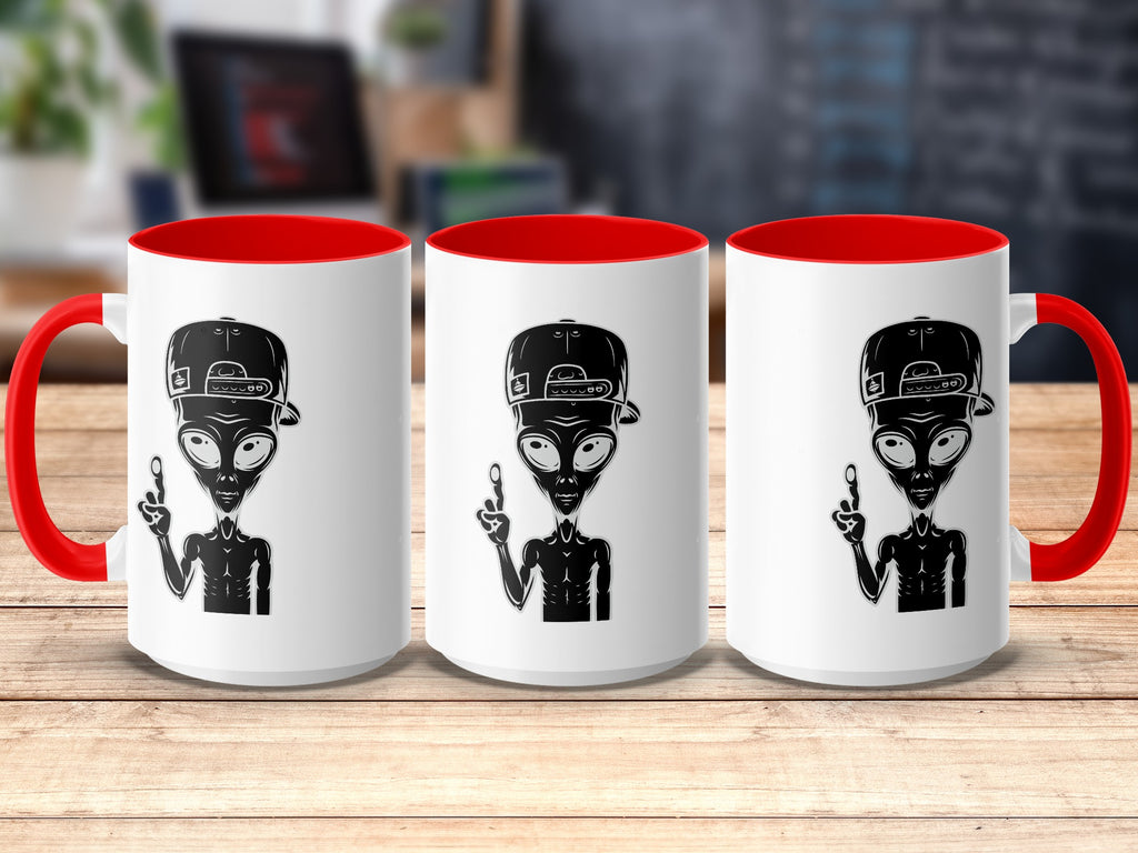 Three white mugs with red handles and rims, each featuring a black alien graphic.