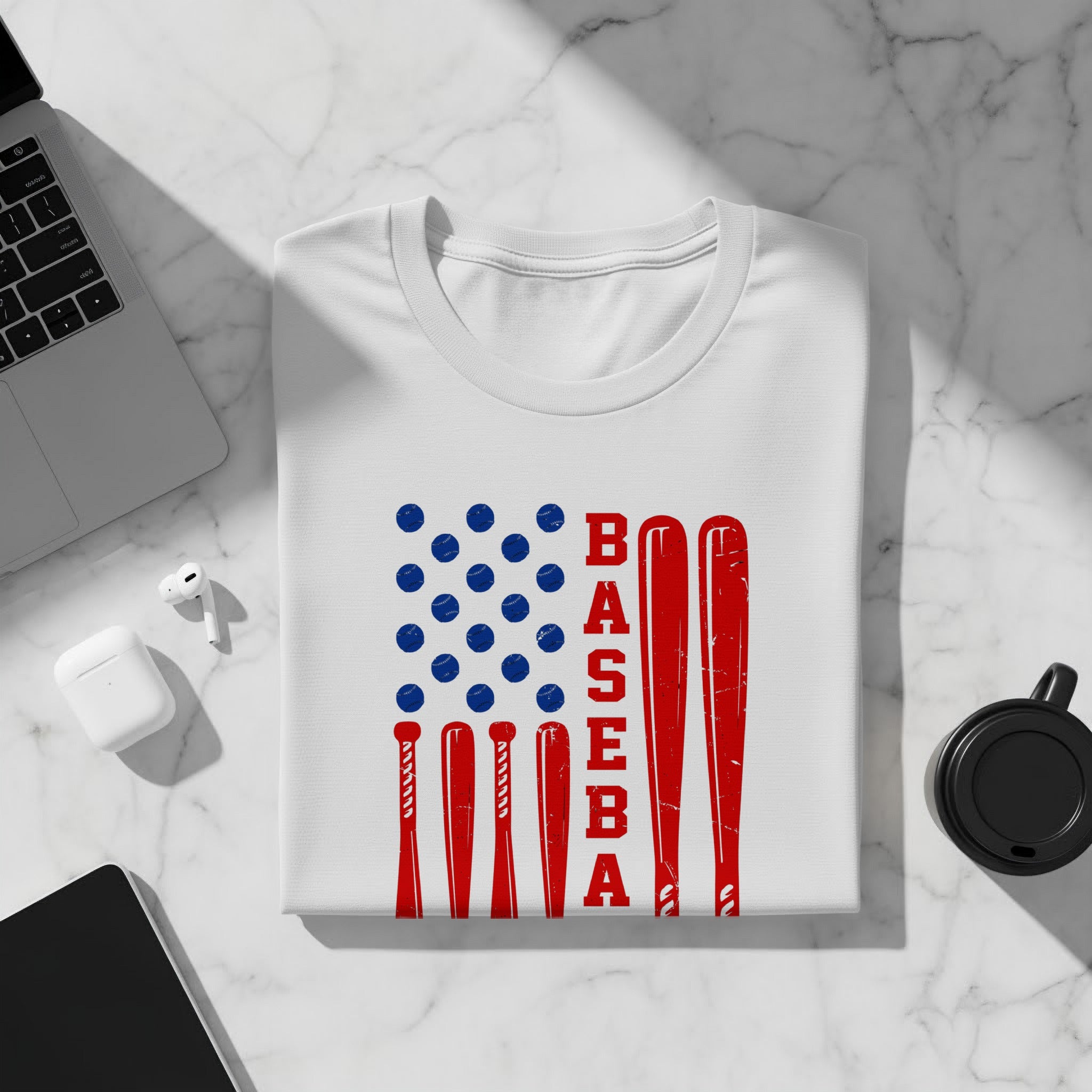 White t-shirt with American flag design featuring baseballs and bats.
