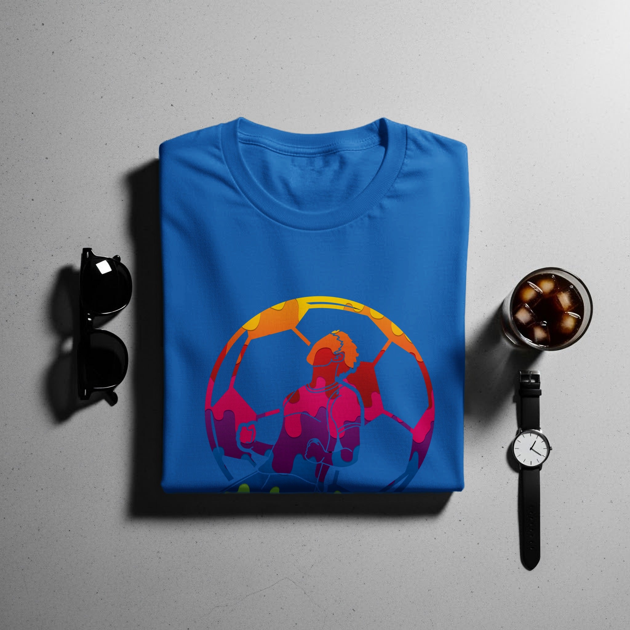 Blue t-shirt with a colorful graphic of a soccer player inside a soccer ball.