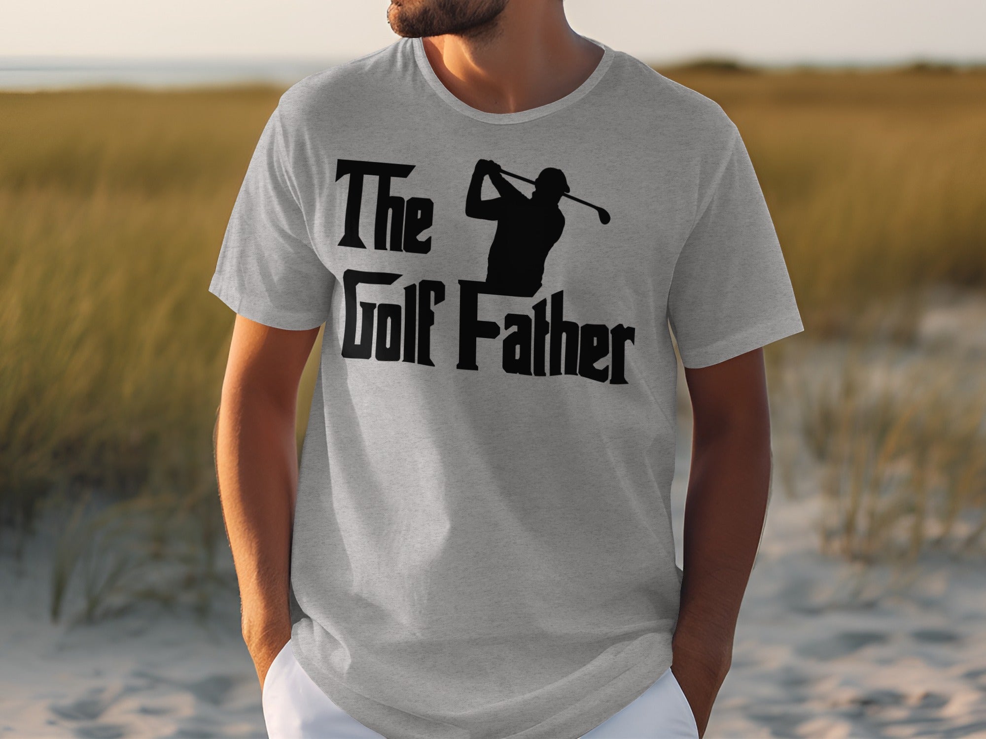 Grey t-shirt with black text and silhouette of a golfer: "The Golf Father".