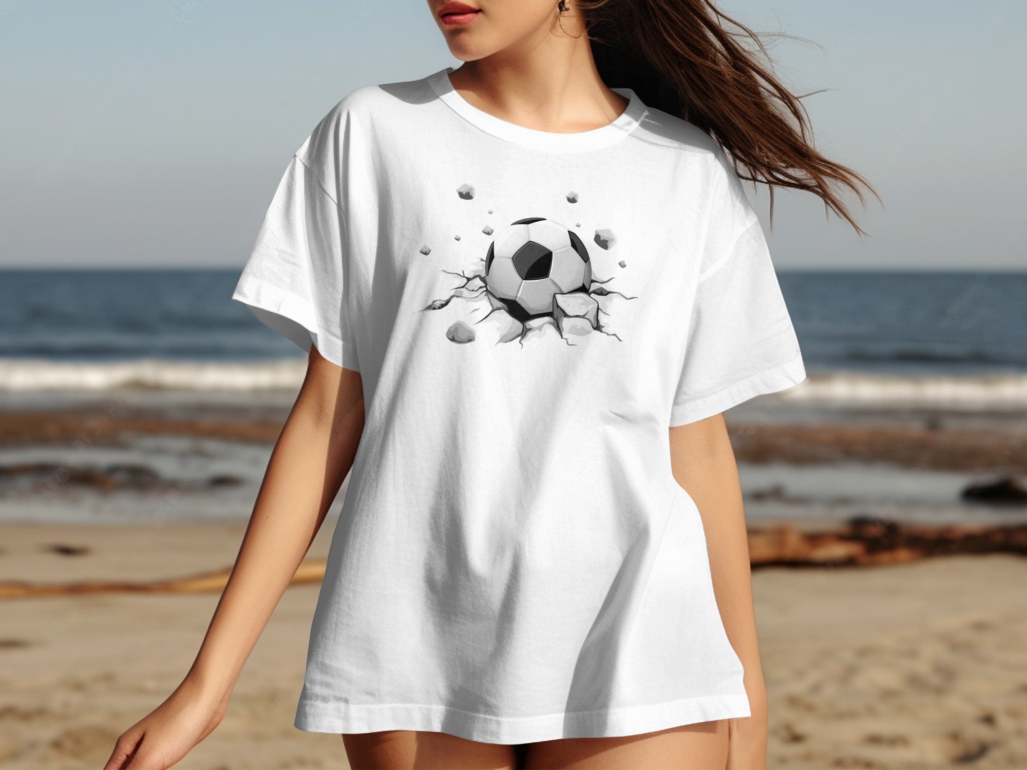 White t-shirt with a cracked earth soccer ball graphic on the front.