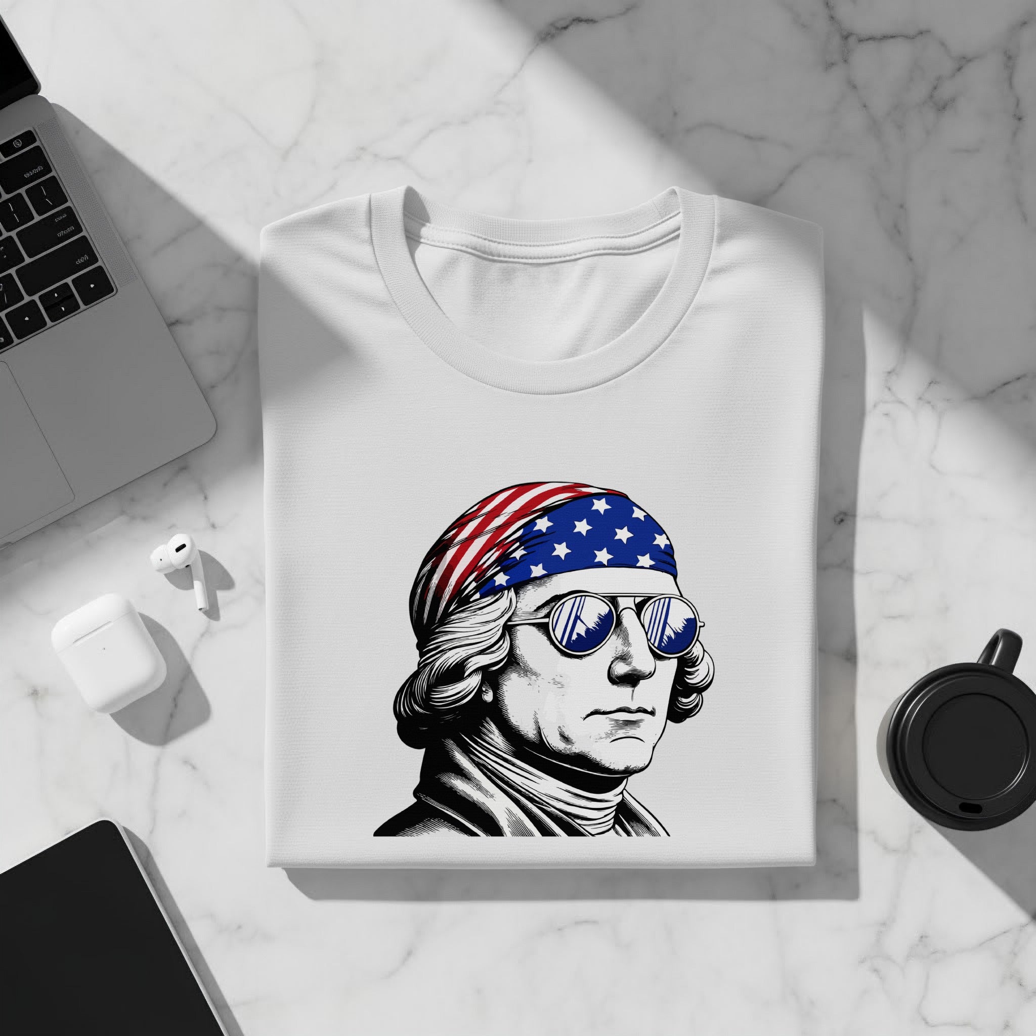 White t-shirt with an illustration of George Washington wearing a US flag bandana and sunglasses.