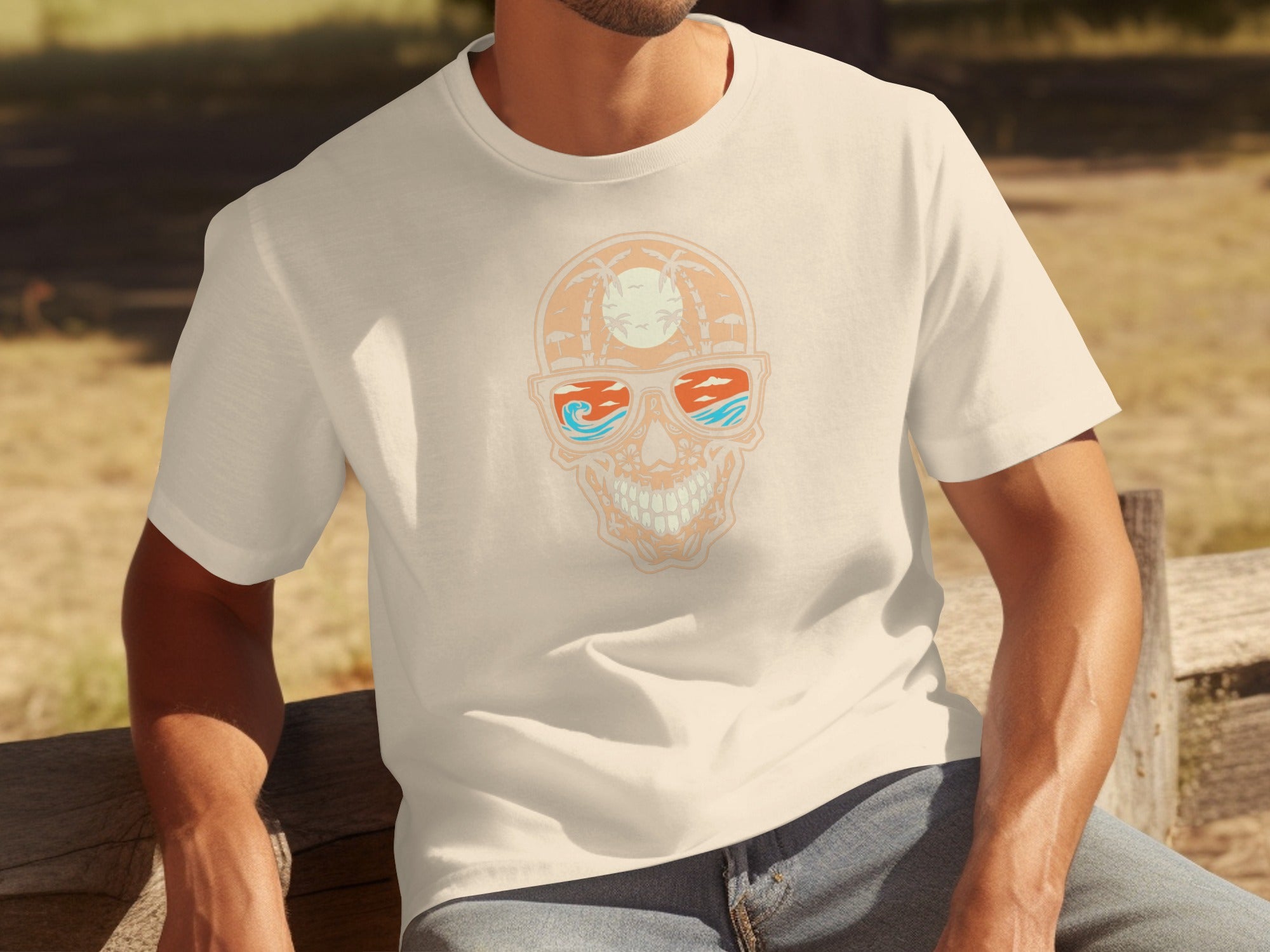 Men's cream t-shirt with a skull graphic featuring sunglasses reflecting a tropical sunset.