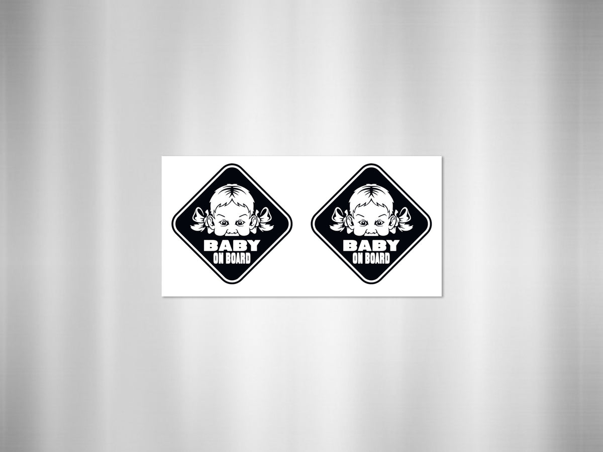 Two "Baby On Board" diamond-shaped stickers featuring a baby's face with bows.