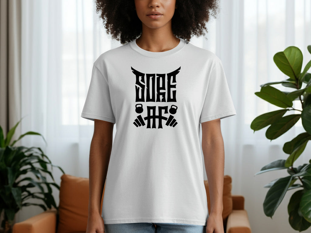 White t-shirt with black "SOAR AF" text and weightlifting graphics.