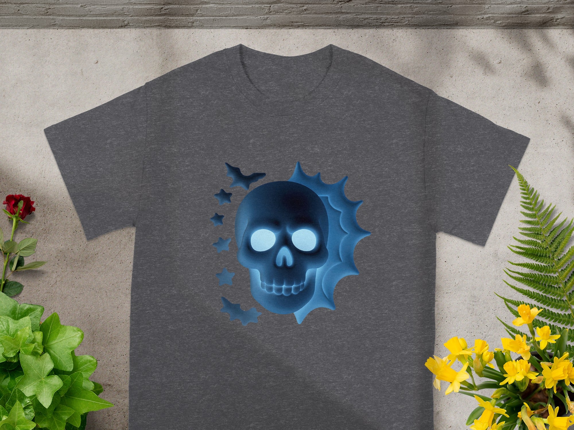 Dark gray t-shirt with a glowing blue skull and bats graphic.