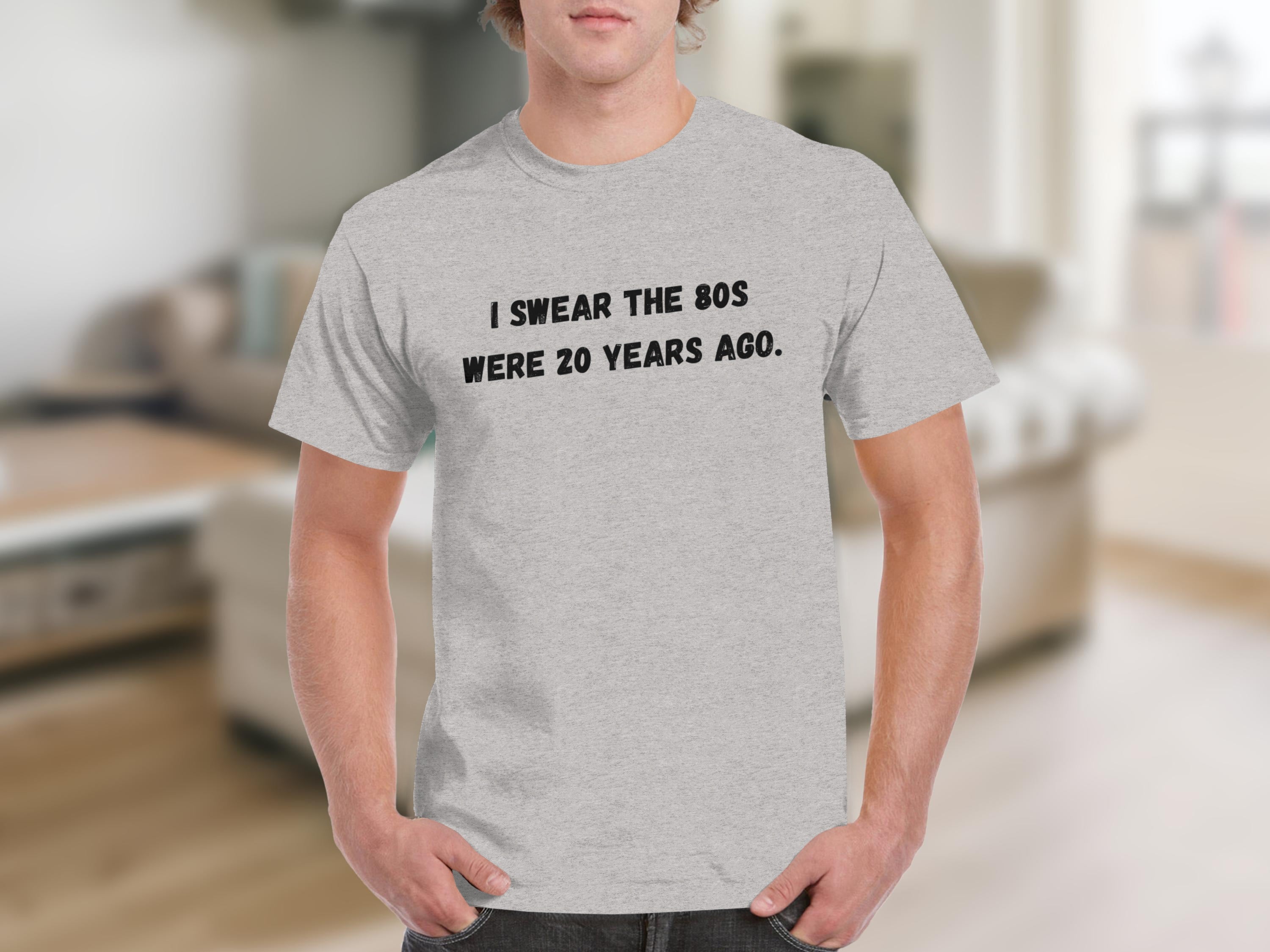 Light grey t-shirt with black text "I SWEAR THE 80S WERE 20 YEARS AGO."