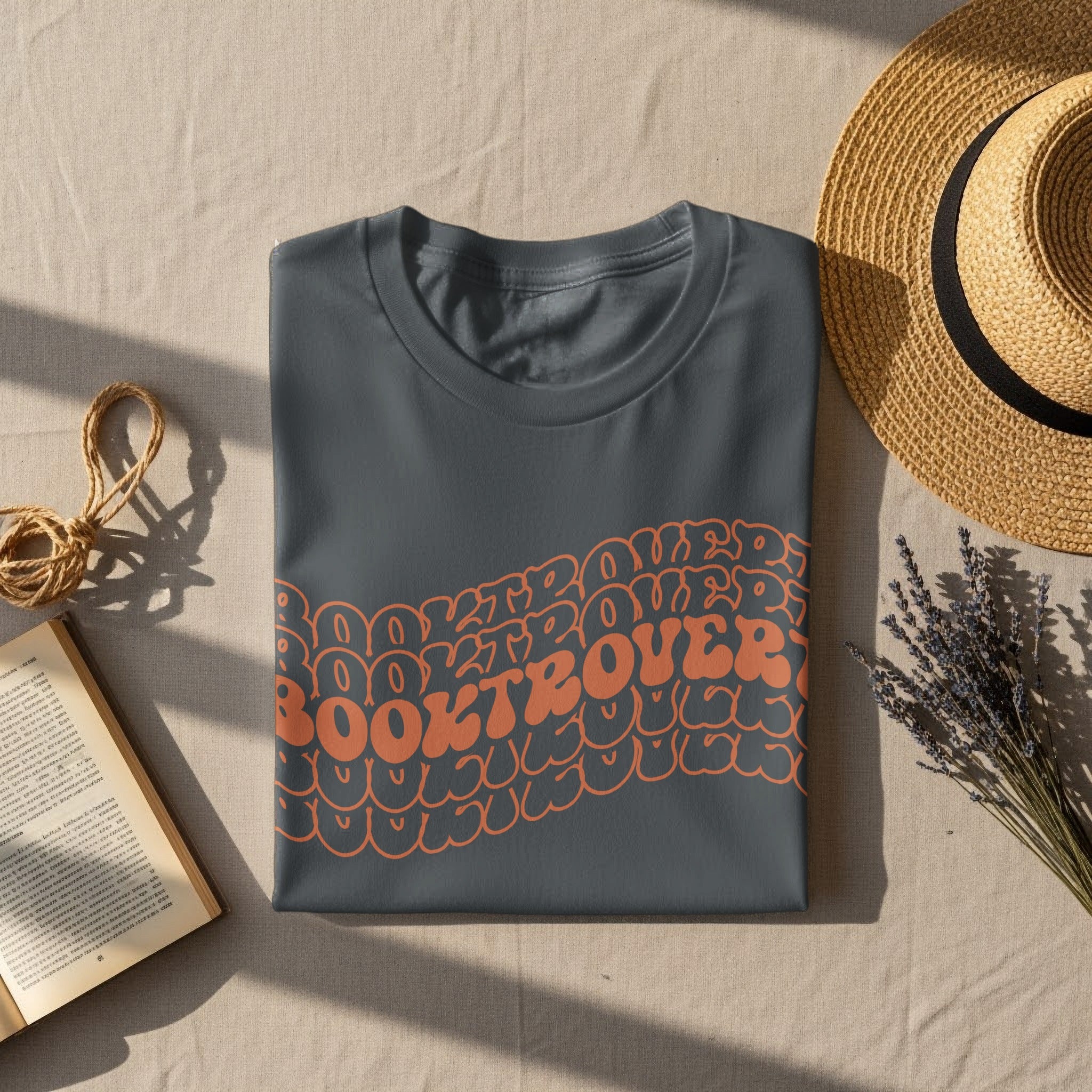 Dark gray t-shirt with "BOOKTROVER" in bubbly orange text.
