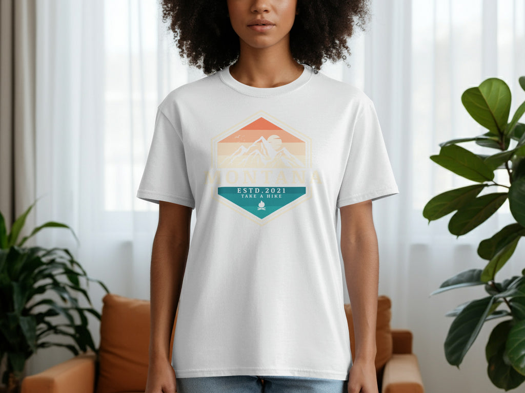 White t-shirt with Montana Estd. 2021 Take a Hike mountain graphic.