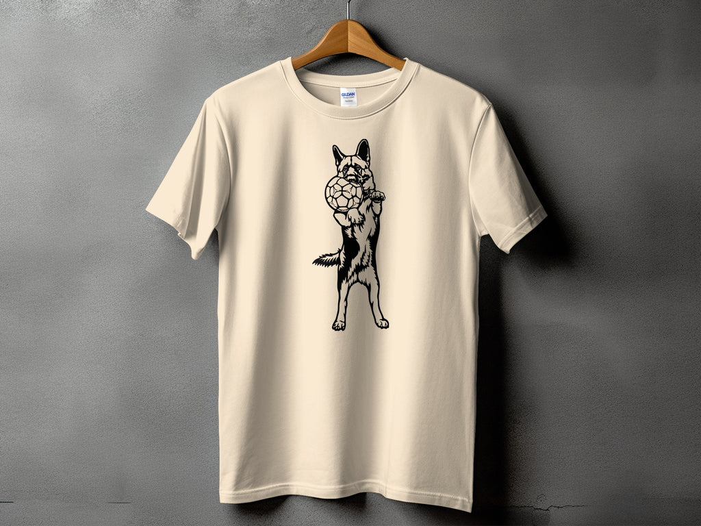 Beige t-shirt with black graphic of a German Shepherd holding a soccer ball.