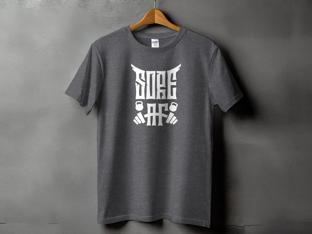 Grey t-shirt with white text and graphics featuring kettlebells and barbell elements.