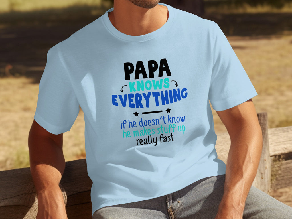 Blue t-shirt with text "PAPA KNOWS EVERYTHING if he doesn't know he makes stuff up really fast".