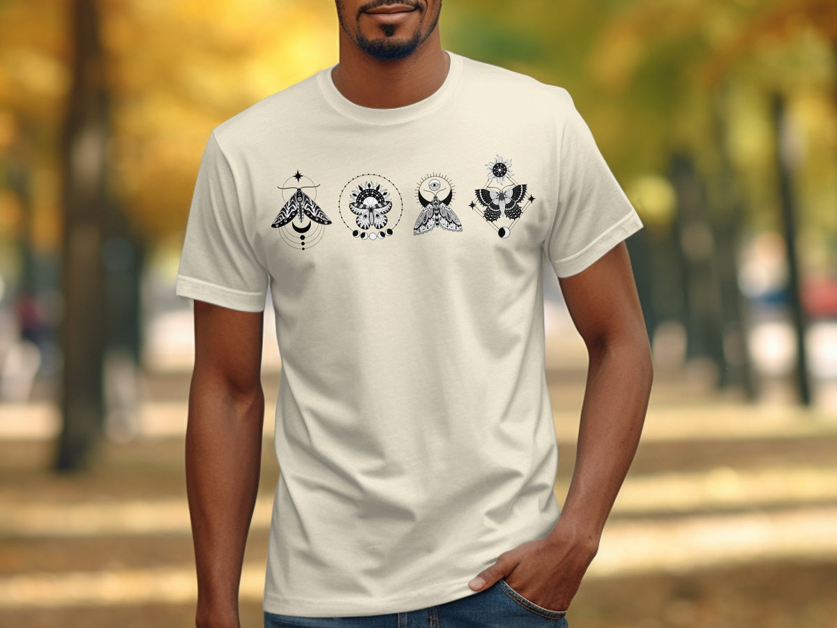 Cream t-shirt with four black moth graphic designs and celestial elements.
