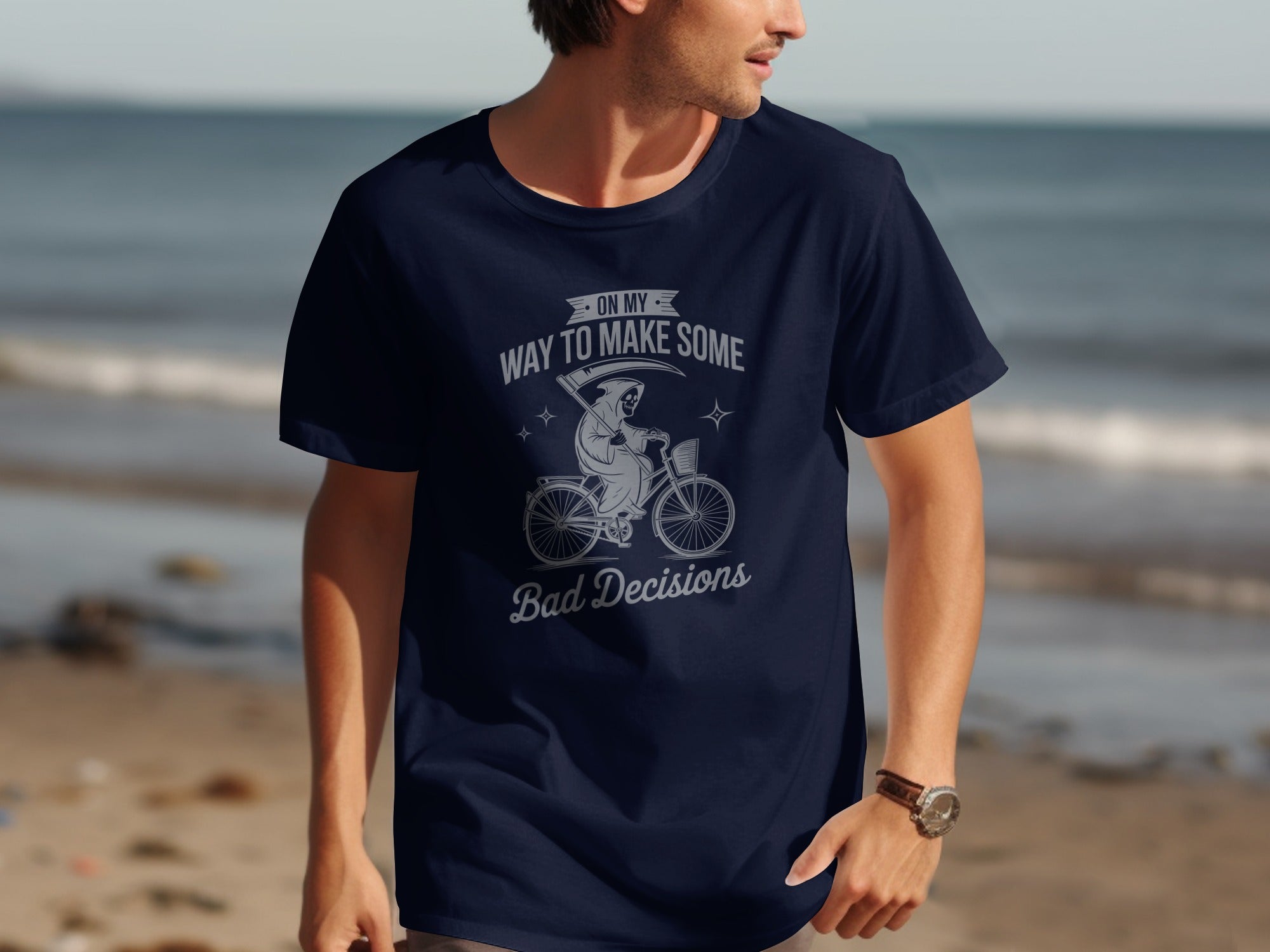 Navy t-shirt with grim reaper on bicycle graphic and text "ON MY WAY TO MAKE SOME Bad Decisions".